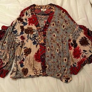 UMGEE  size large blouse with beautiful floral detail.